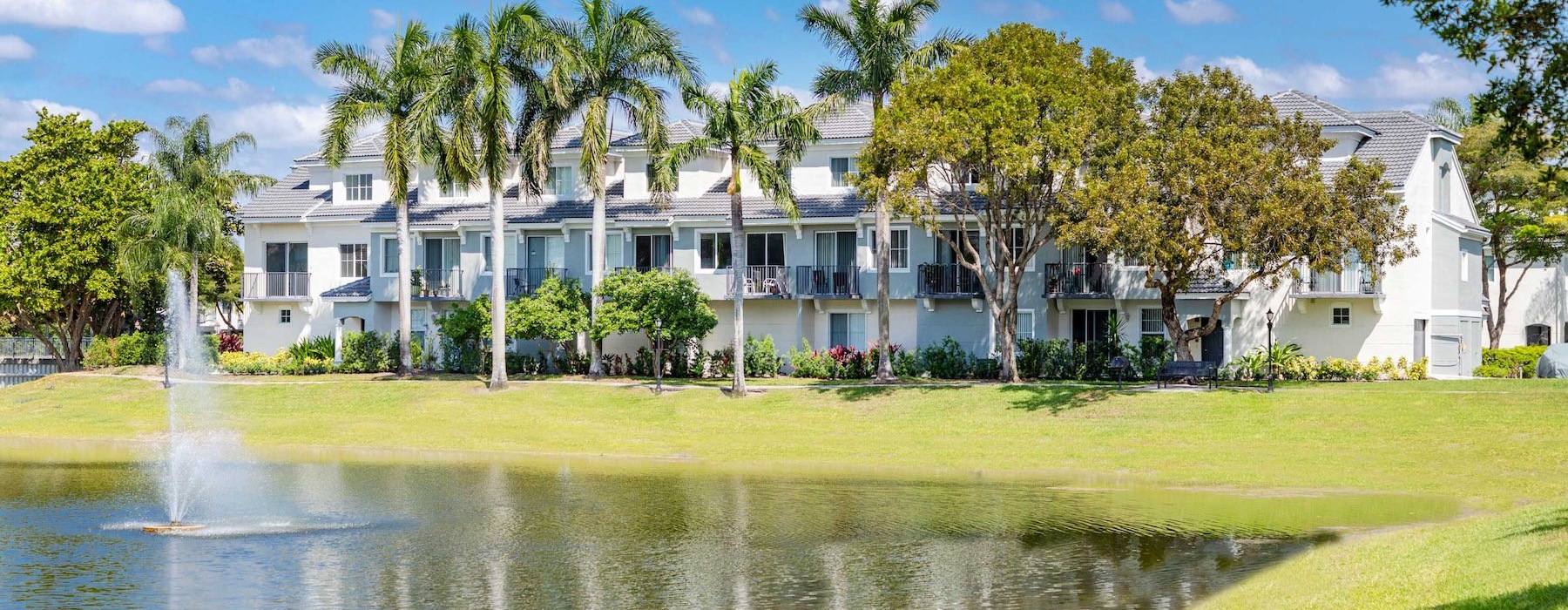 a building with trees and grass around it