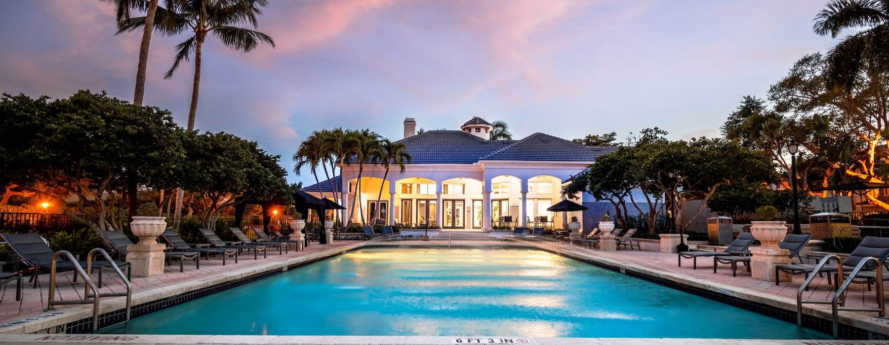 a pool with a building in the background