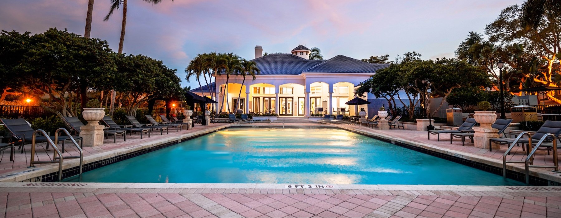 a pool with a building in the background