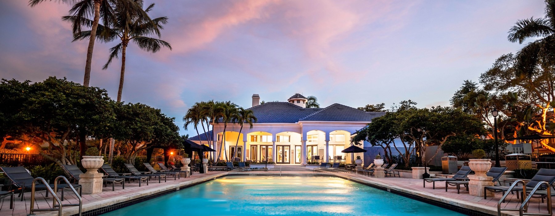 a pool with a building in the background